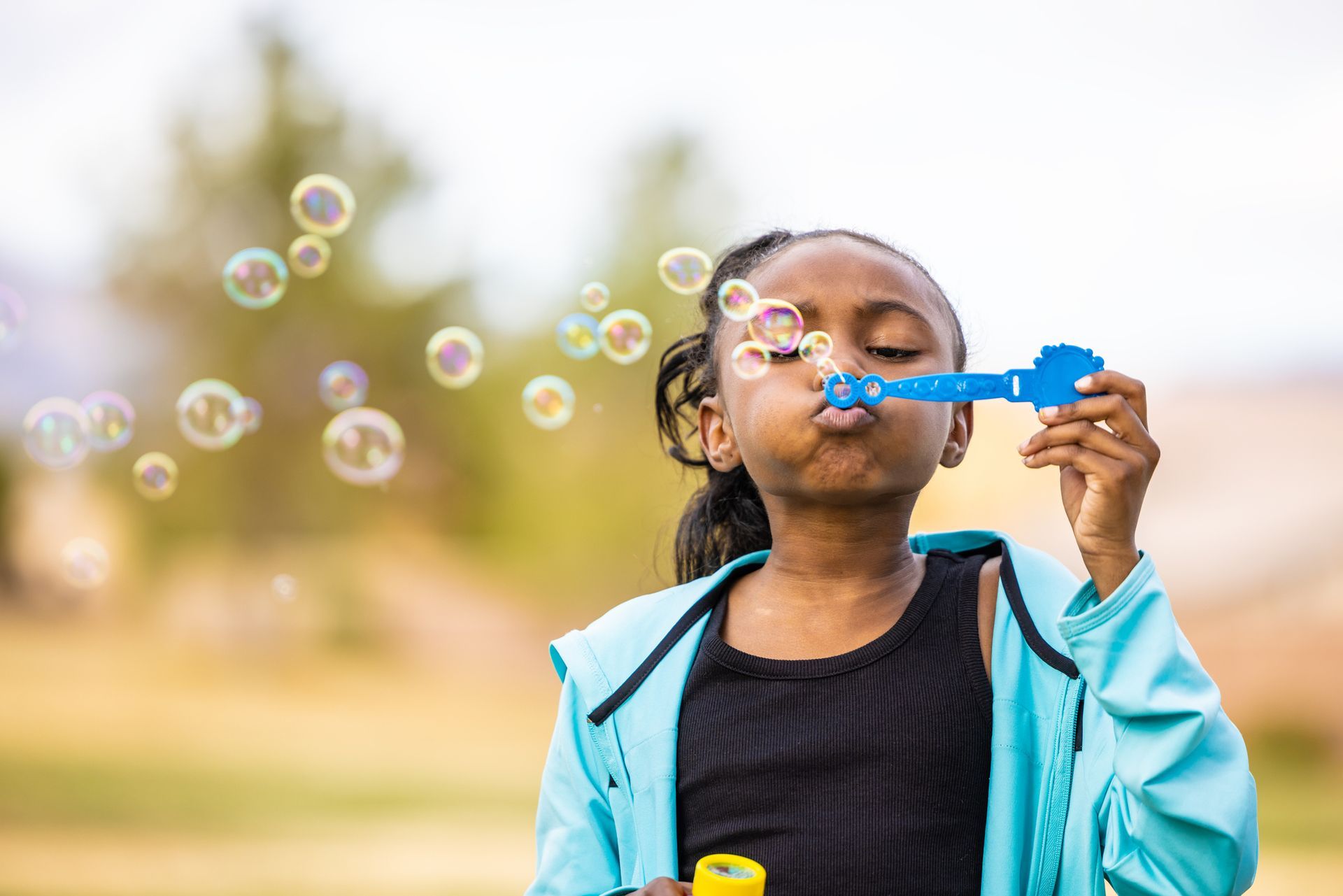 Girl blowing bubbles