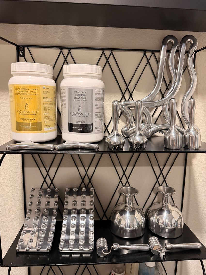 Shelved kitchen supplies: two labeled jars, metal molds, and utensils on wire racks