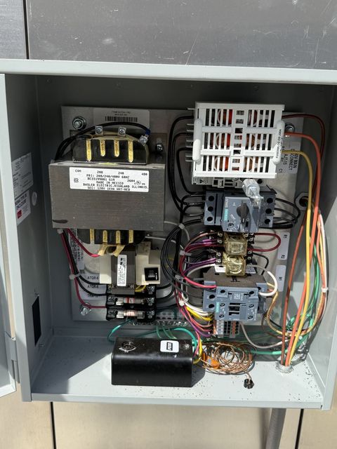 Commercial control panel with contactors during service
