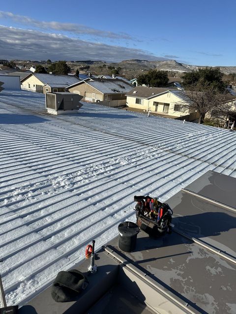 Commercial rooftop unit on a snow-covered roof in the Prescott area
