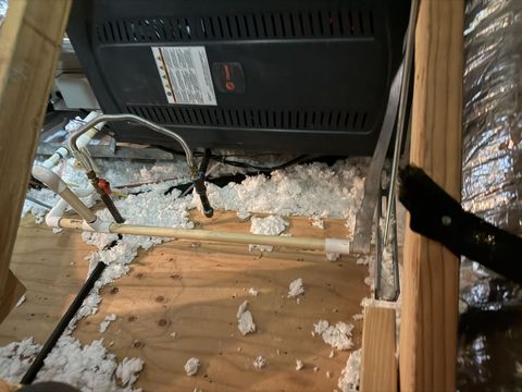 Water heater serviced in an attic installation