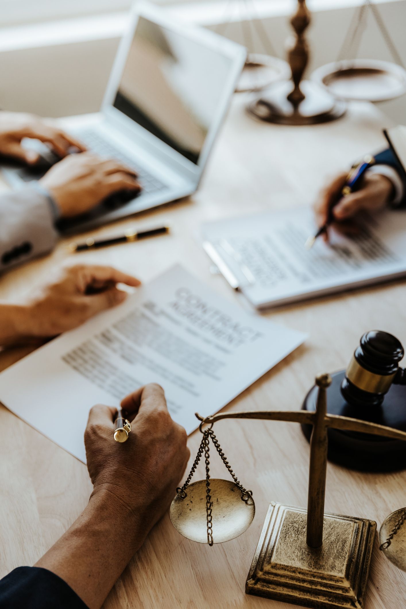 A Person Is Writing on a Piece of Paper Next to a Scale of Justice | Sydney, NSW | Online Divorce Australia