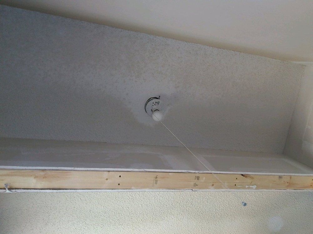 A light is hanging from the ceiling of a room.