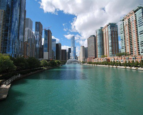 A large body of water surrounded by tall buildings in a city