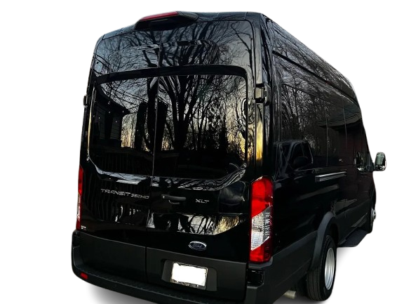 The back of a black ford van with the door open