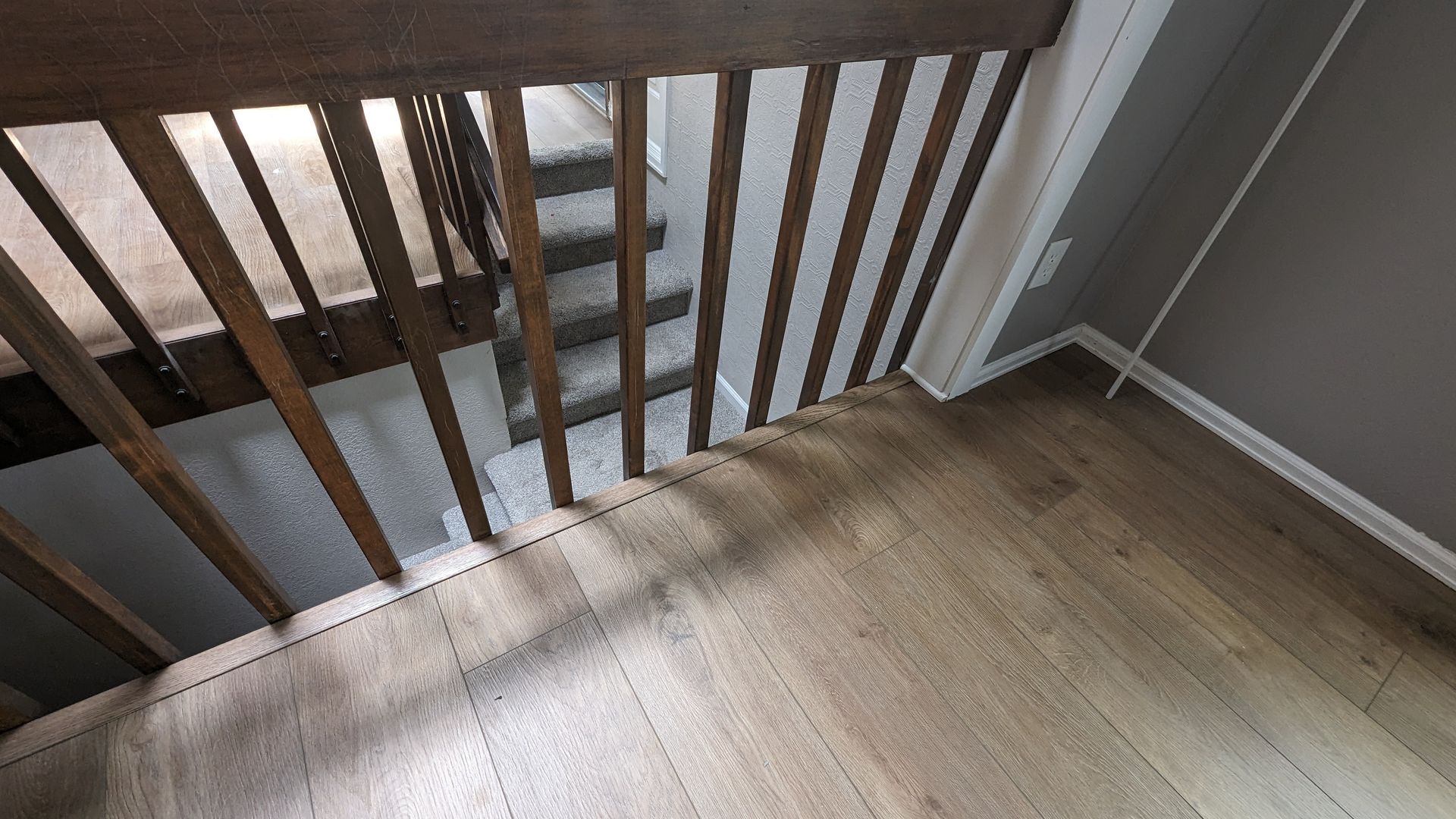 LVT flooring with a wood railing