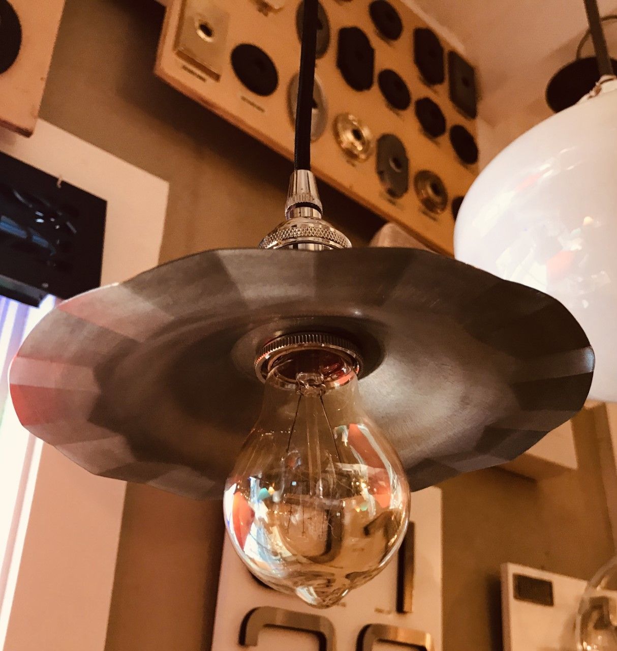 Vintage-style pendant light with a fluted metal shade and exposed Edison bulb.