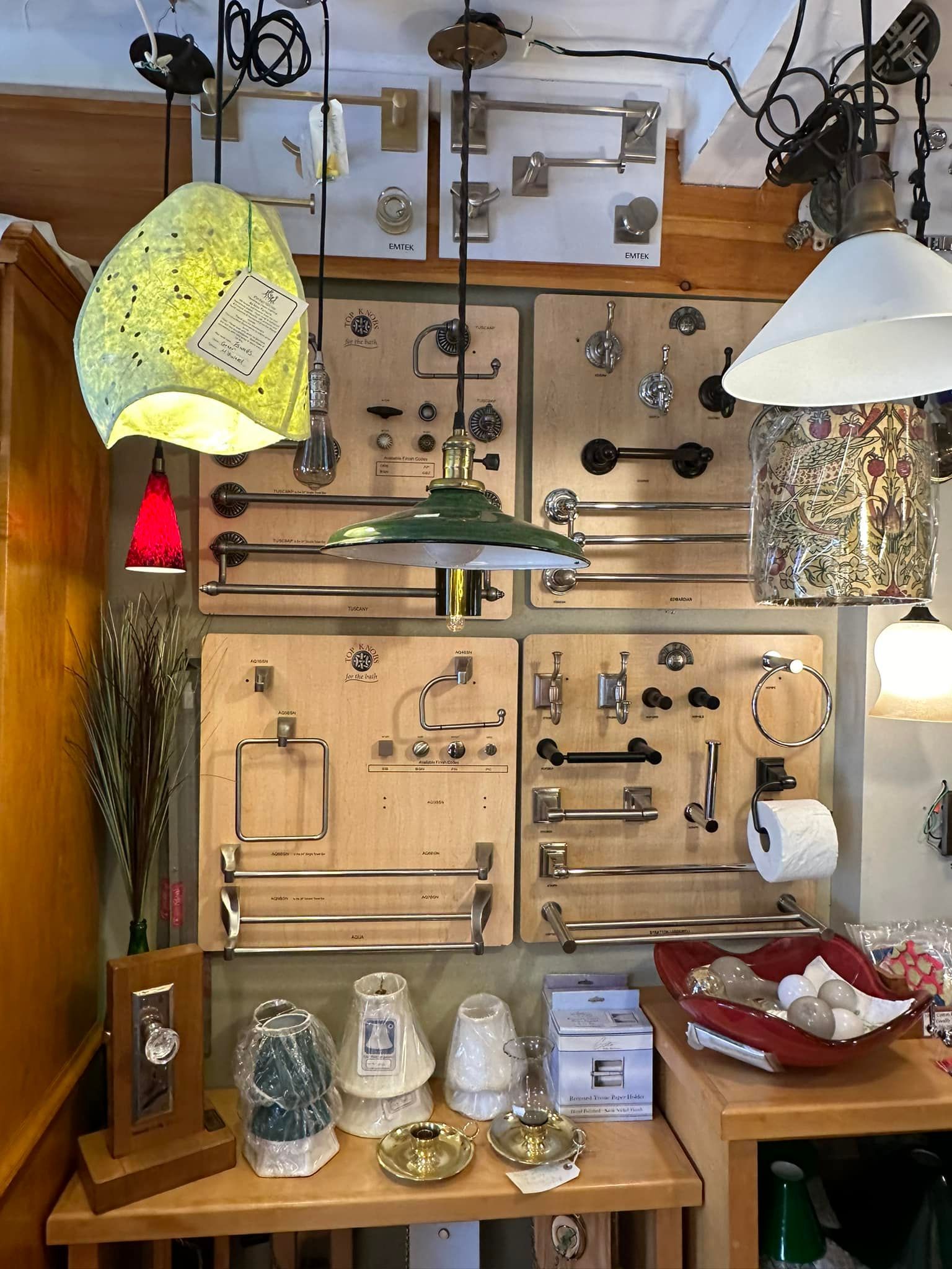 Shop display of various light fixtures and bathroom hardware.