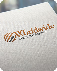 A close up of a worldwide insurance agency logo on a piece of paper.