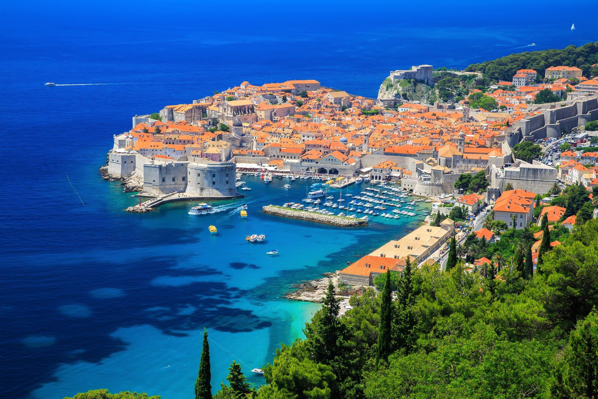 Croatia An aerial view of a city next to a body of water.