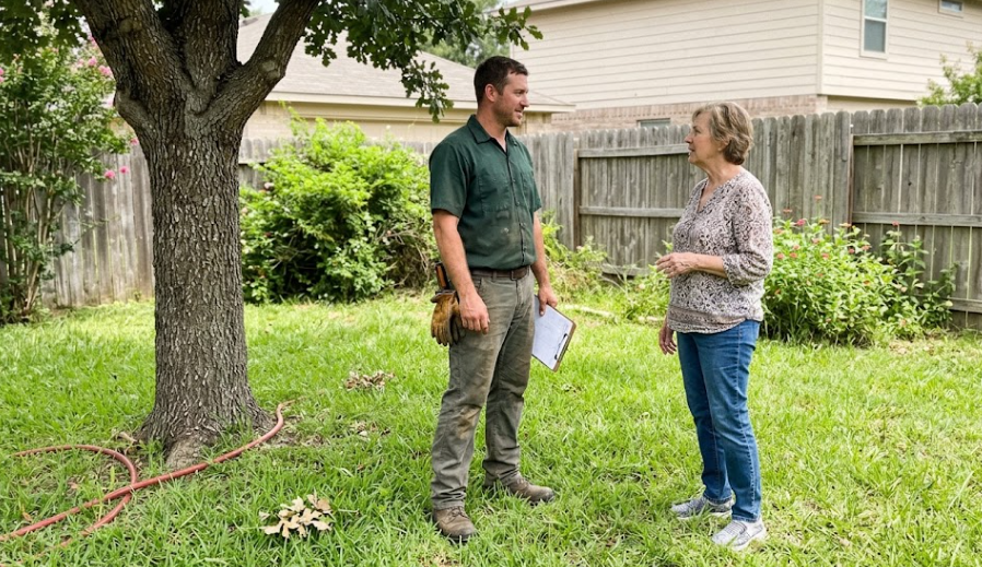 A1 Tree Service and Stump Removal expert consulting with a Spokane homeowner about tree health.