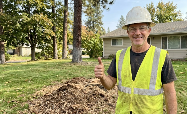 A friendly local stump removal expert in Spokane WA giving a thumbs up.
