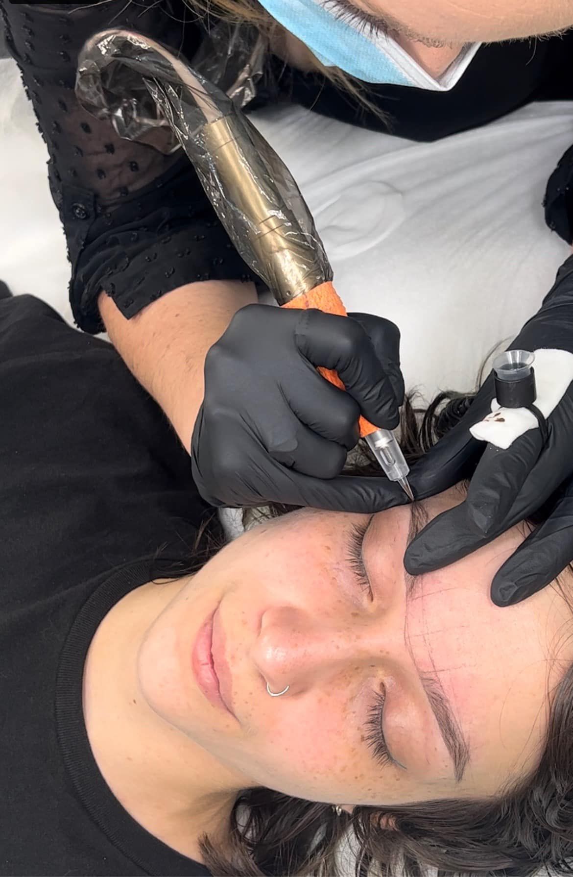 Person Receiving Microblading on Their Eyebrow — Artisan Cosmetic Tattoo & Beauty in Worongary, QLD