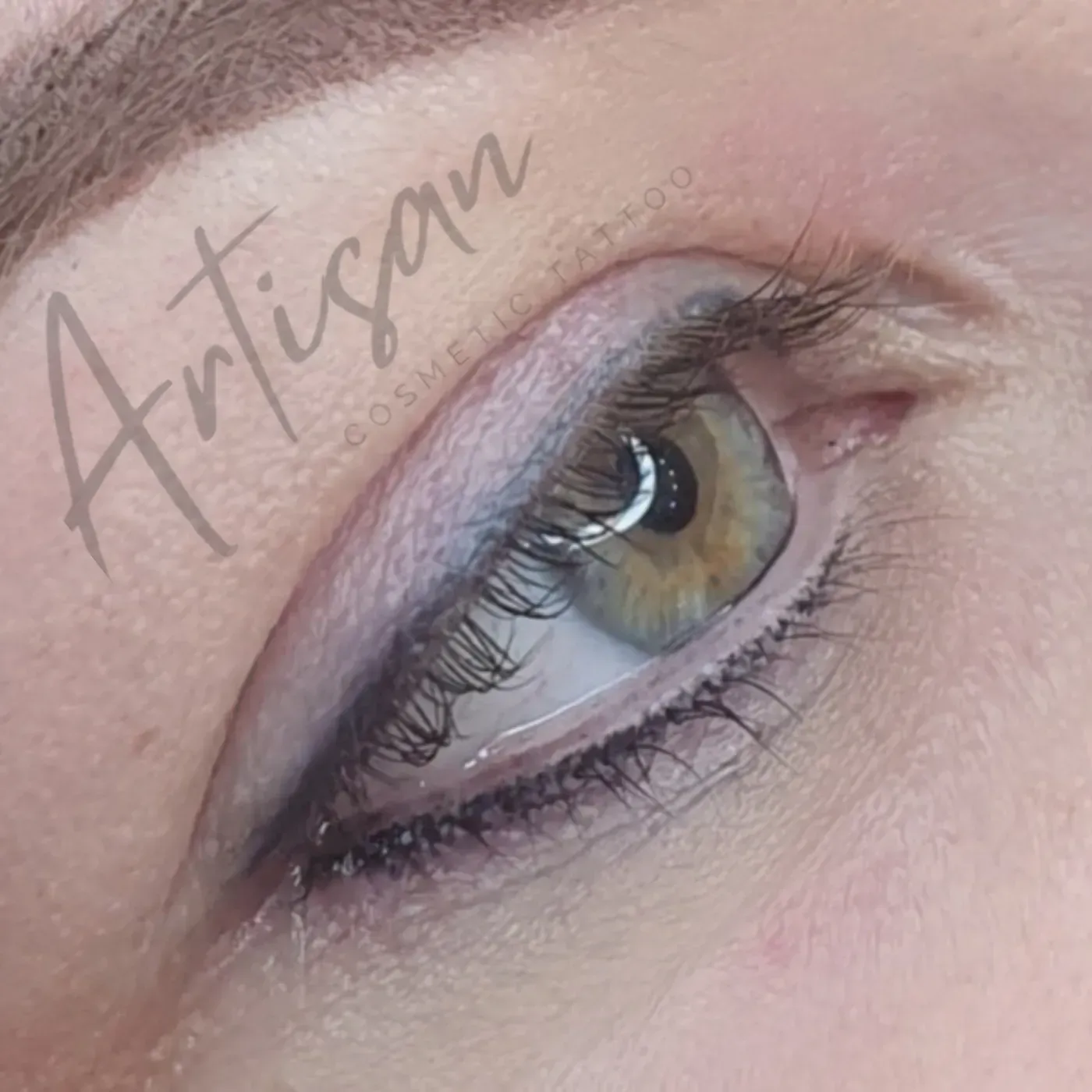 Green eye with subtle dark eyeliner tattoo along the upper lash line — Artisan Cosmetic Tattoo, Worongary QLD