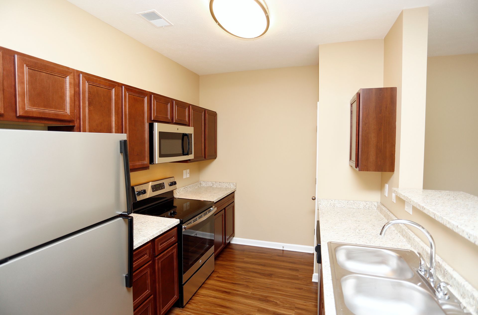 A kitchen with stainless steel appliances and granite counter tops