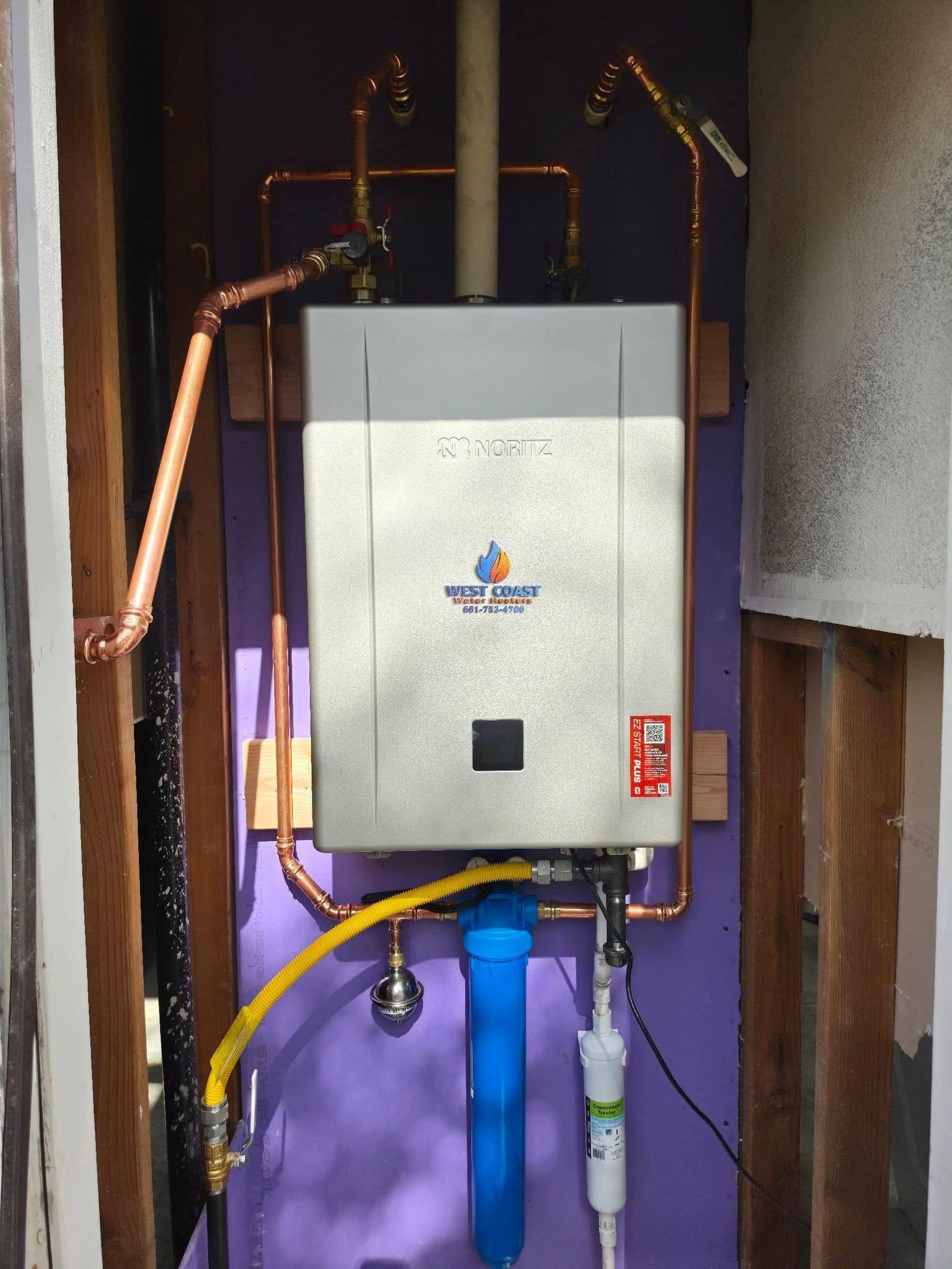 Wall-mounted boiler and copper plumbing pipes in a utility room, with a blue filter below.
