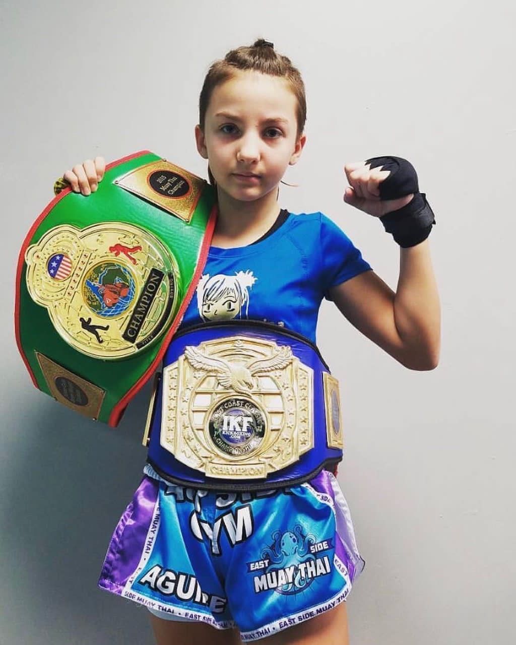 Young person in Muay Thai gear.