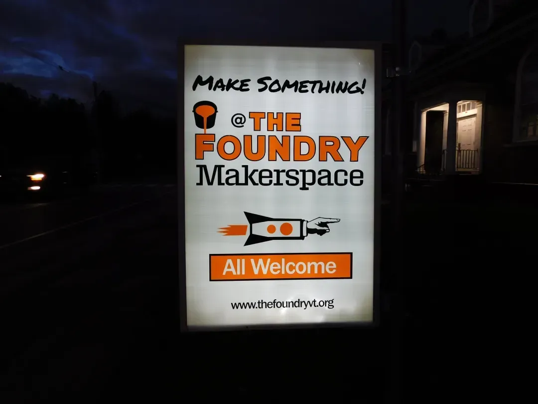 a sign that says make something at the foundry makerspace