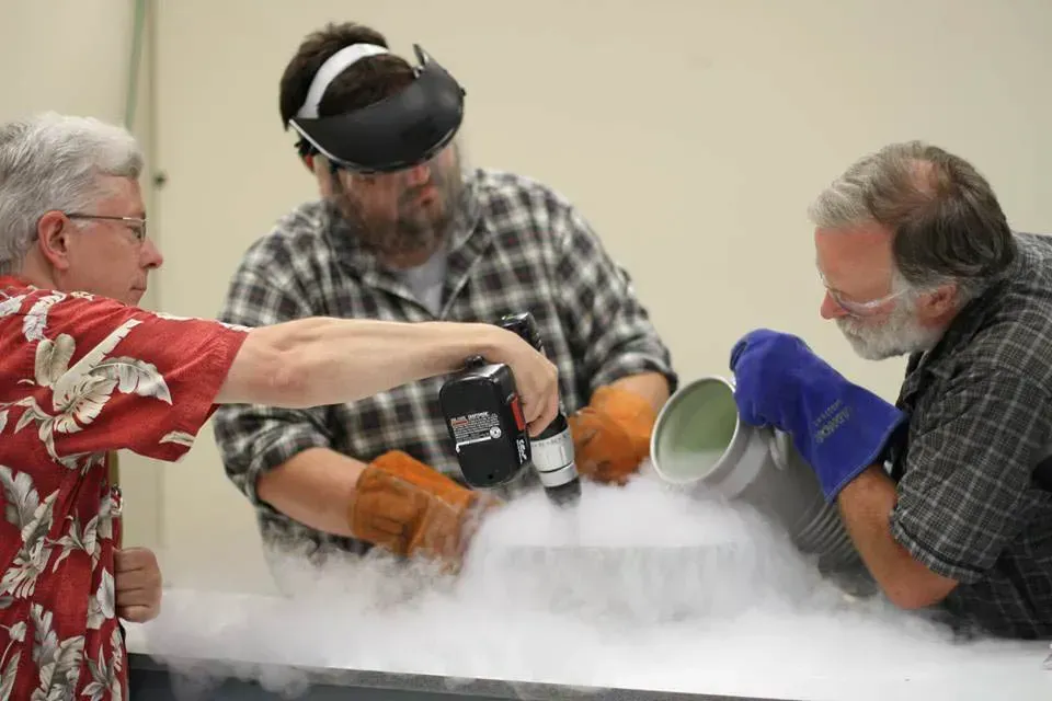 three men are working on a project with liquid nitrogen