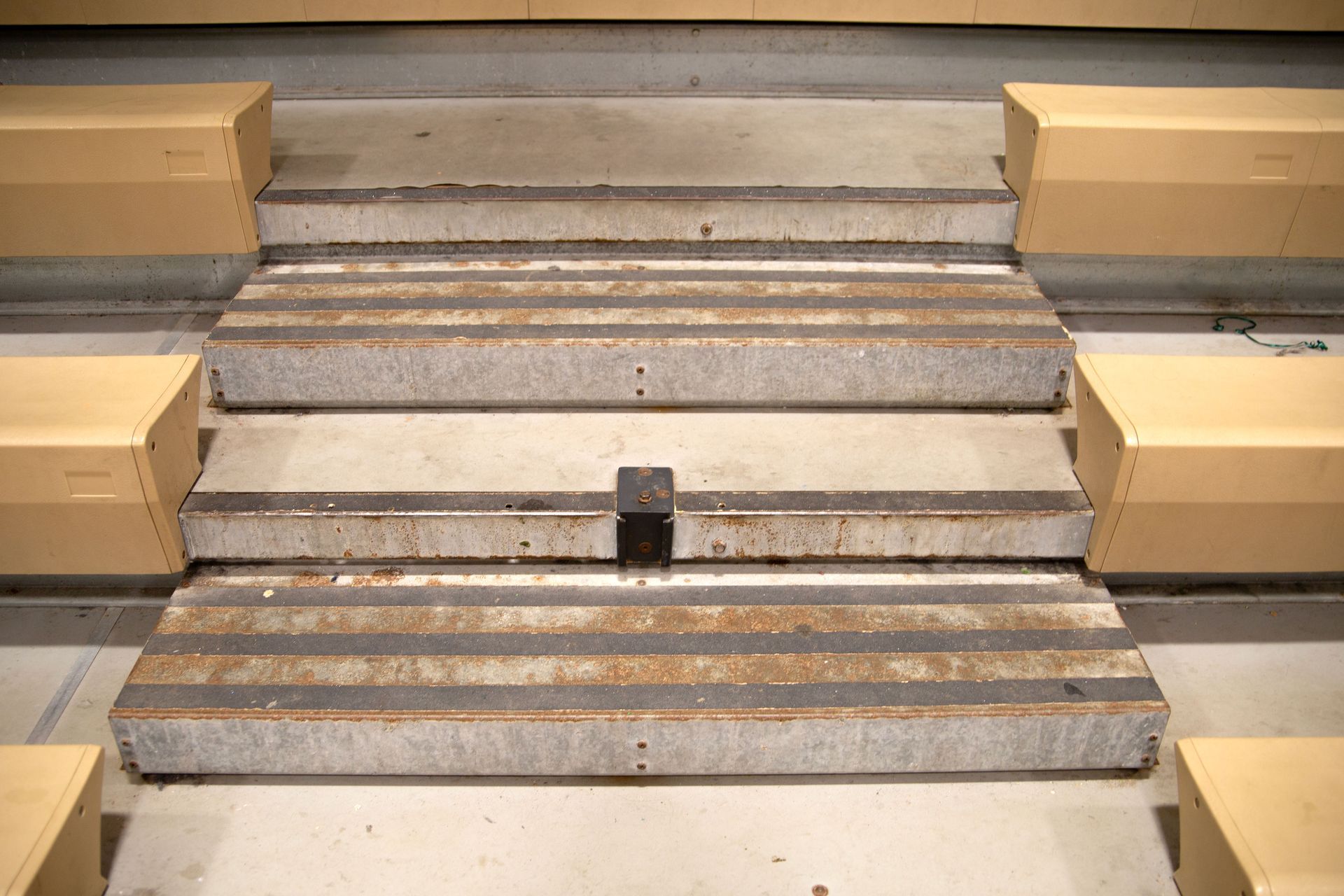 The steps on the Interkal telescopic bleachers at Holy Name Catholic School before renovation