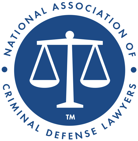 National Association of Criminal Defense Lawyers logo: Scales of justice in white on a blue circle. Text:
