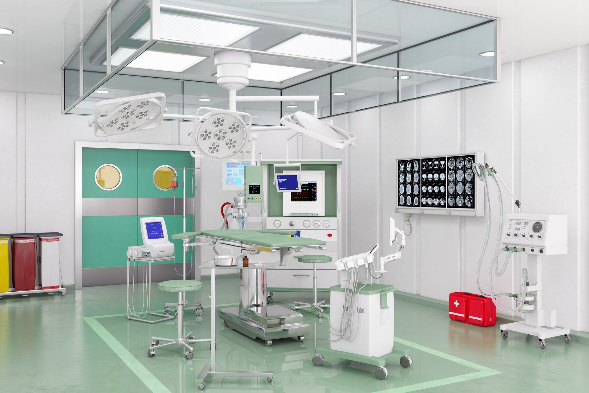 Sala operatoria con attrezzatura chirurgica, pareti verdi e bianche, luci sospese e un display medico.
