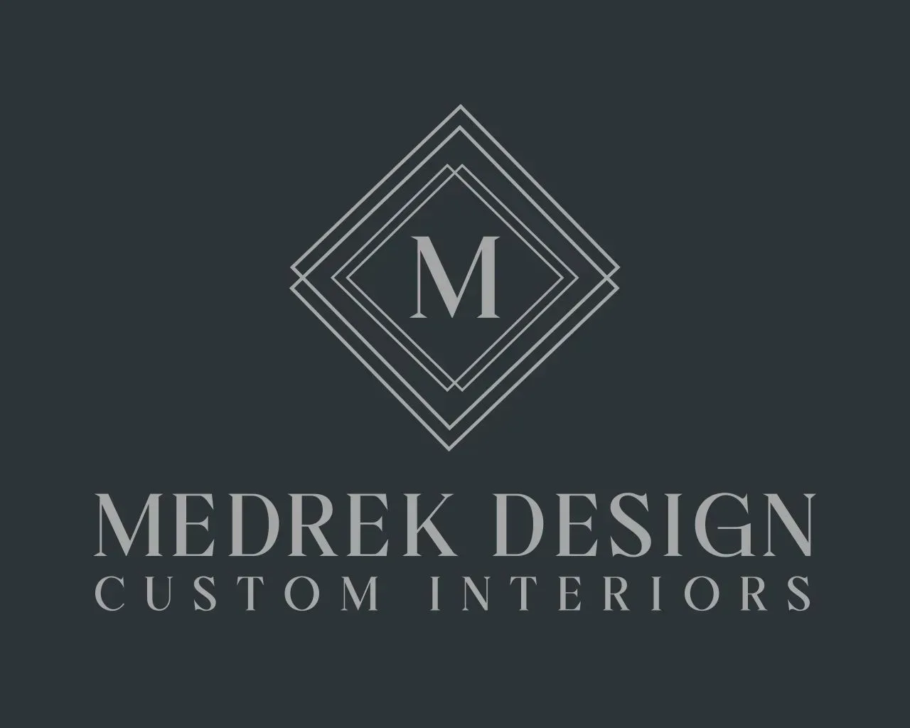 Logo for Medrek Design. Silver geometric diamond with 