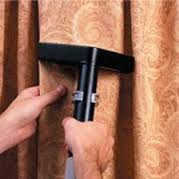Removing Dust from Curtain — Punta Gorda, FL — Superior Carpet & Upholstery Cleaning Inc Removing Dust from Curtain — Punta Gorda, FL — Superior Carpet & Upholstery Cleaning Inc