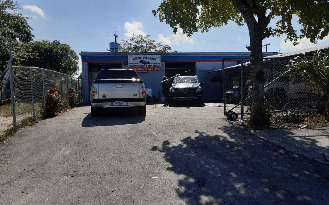 A ford truck is parked in front of a car wash
