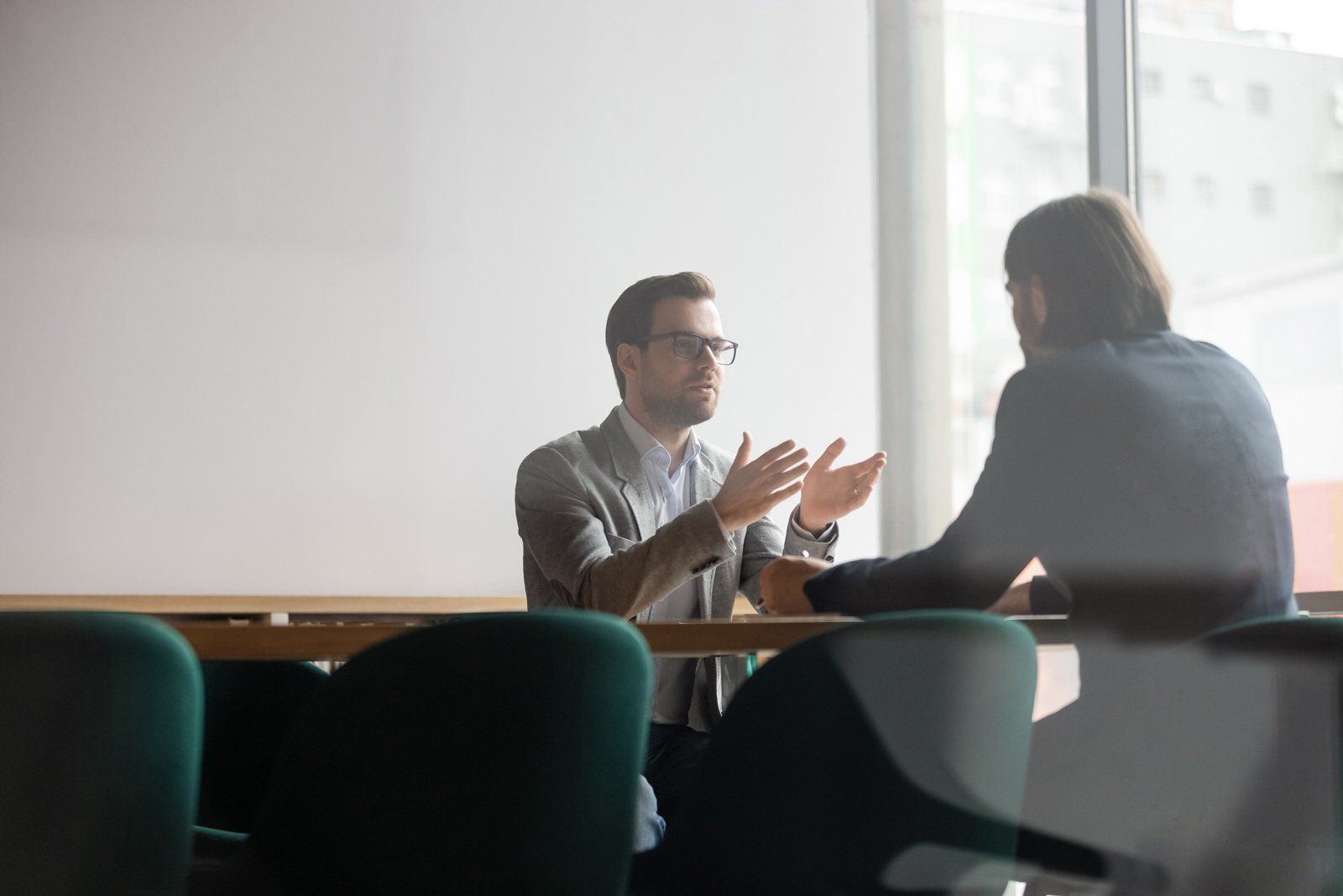 A male counselor talks to his client