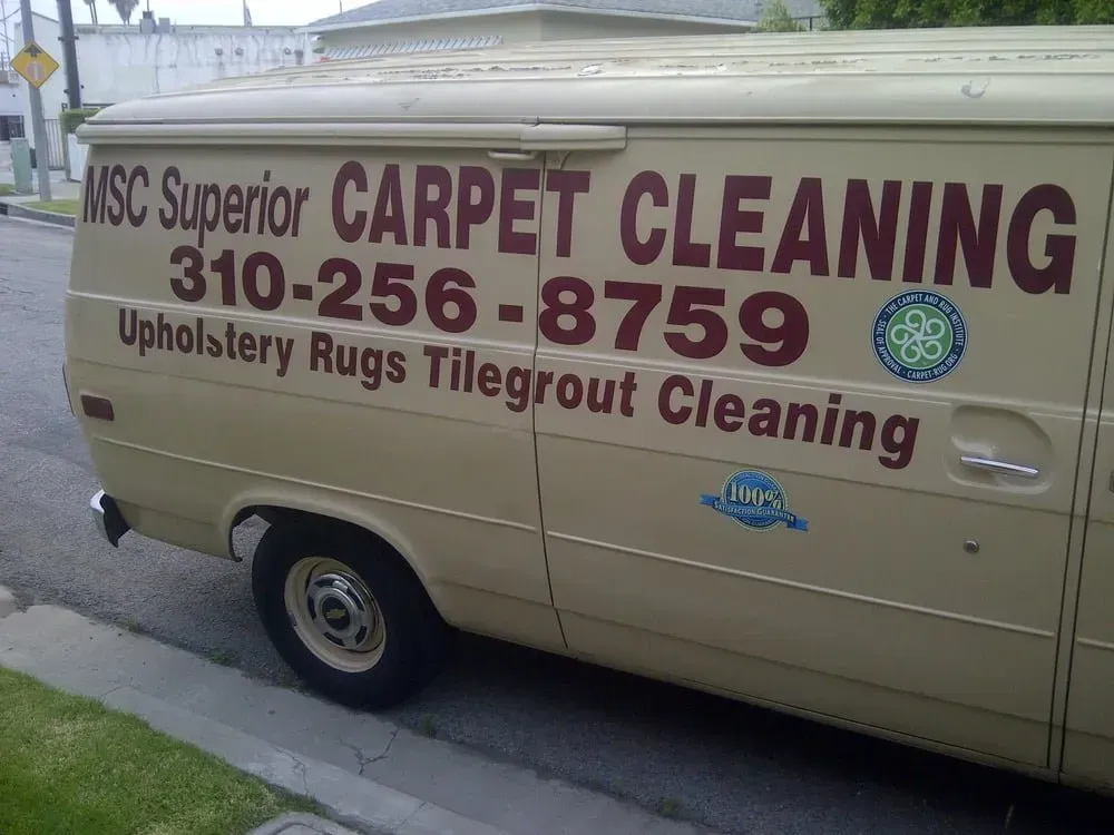 Tan van with “MSC Superior Carpet Cleaning” and phone number 310-256-8759 on the side