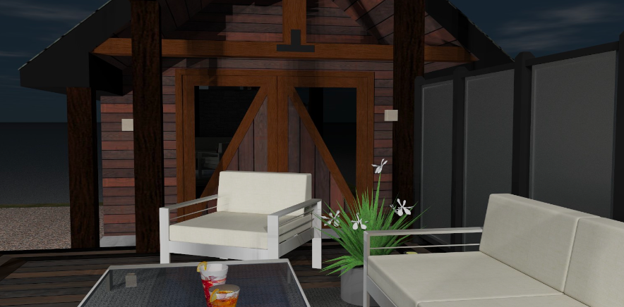 A patio with a couch , chair and table at night.