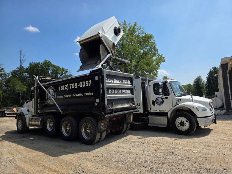 Street sweepers with rotating yellow brushes cleaning a road. Street sweepers with rotating yellow brushes cleaning a road.