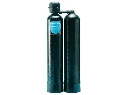 Two tall black water filtration tanks