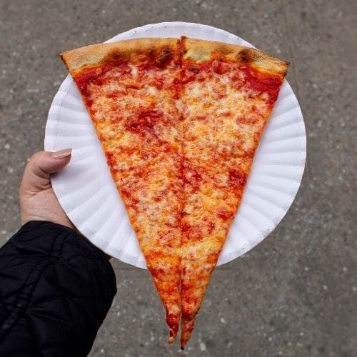 Cheese pizza slice from Mimi’s Pizza on the Upper West Side NYC