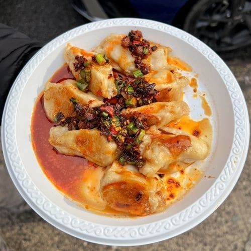 Plate of pan fried dumplings from Tasty Dumpling in Chinatown, NYC