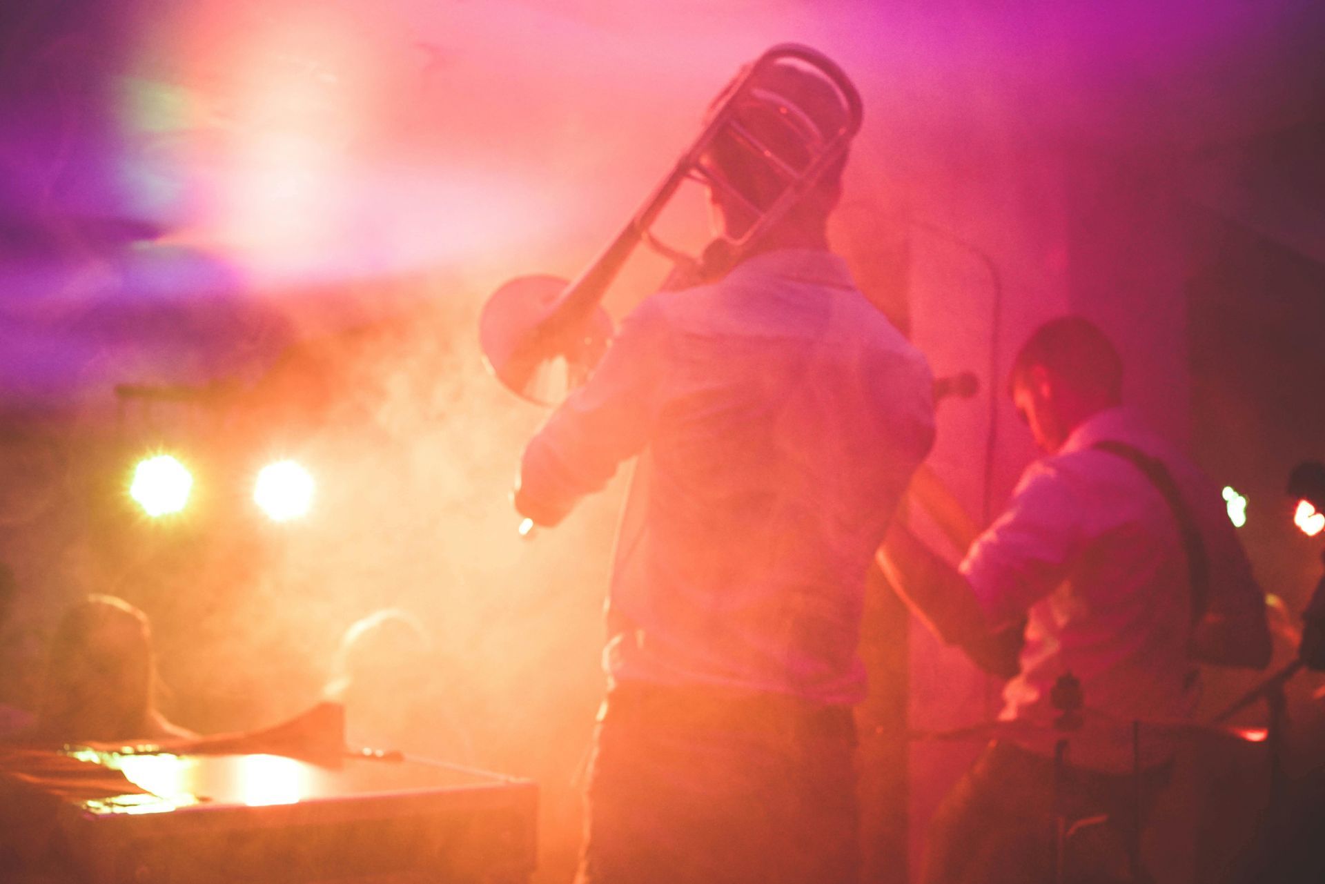 Musicians playing a Trombone and Guitar Inside Cafe Wha?