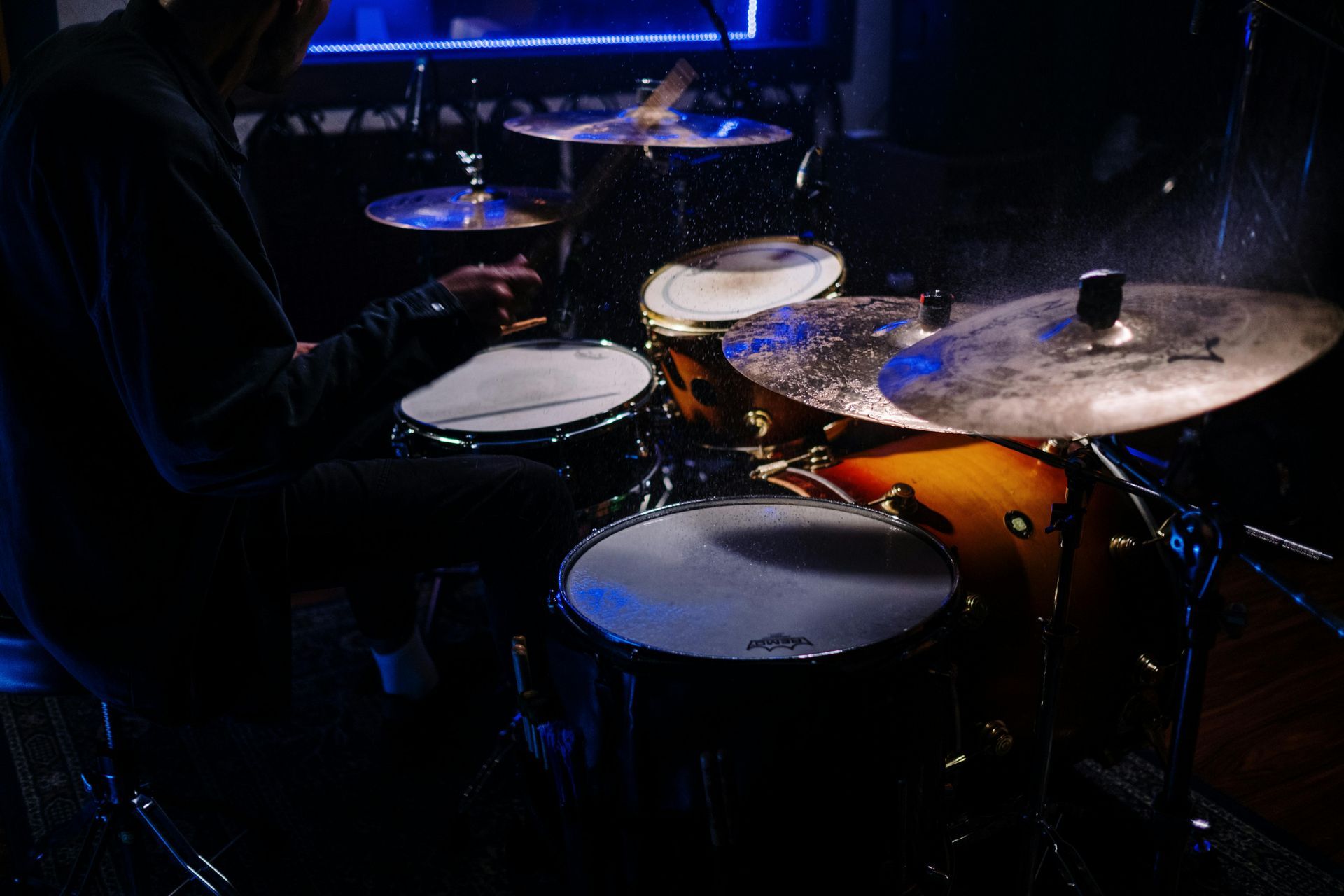 Drummer playing the drums inside the Blue Note Jazz Club in New York City