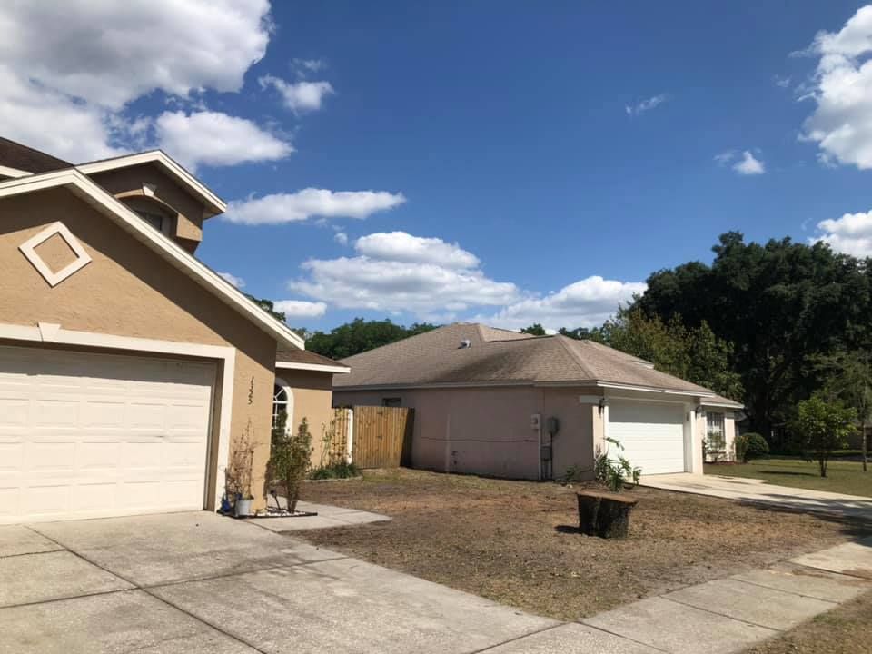 A couple of houses with a blue sky in the background