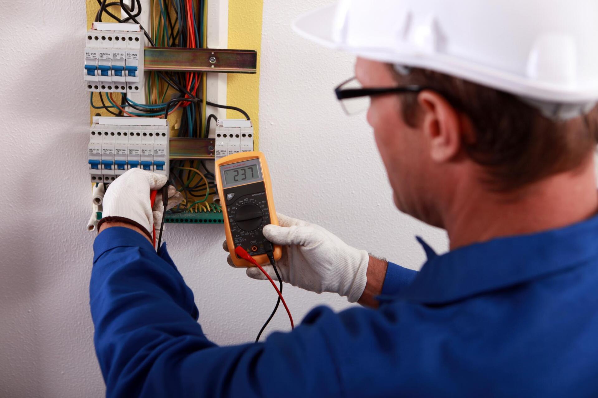 Electrician taking a meter reading