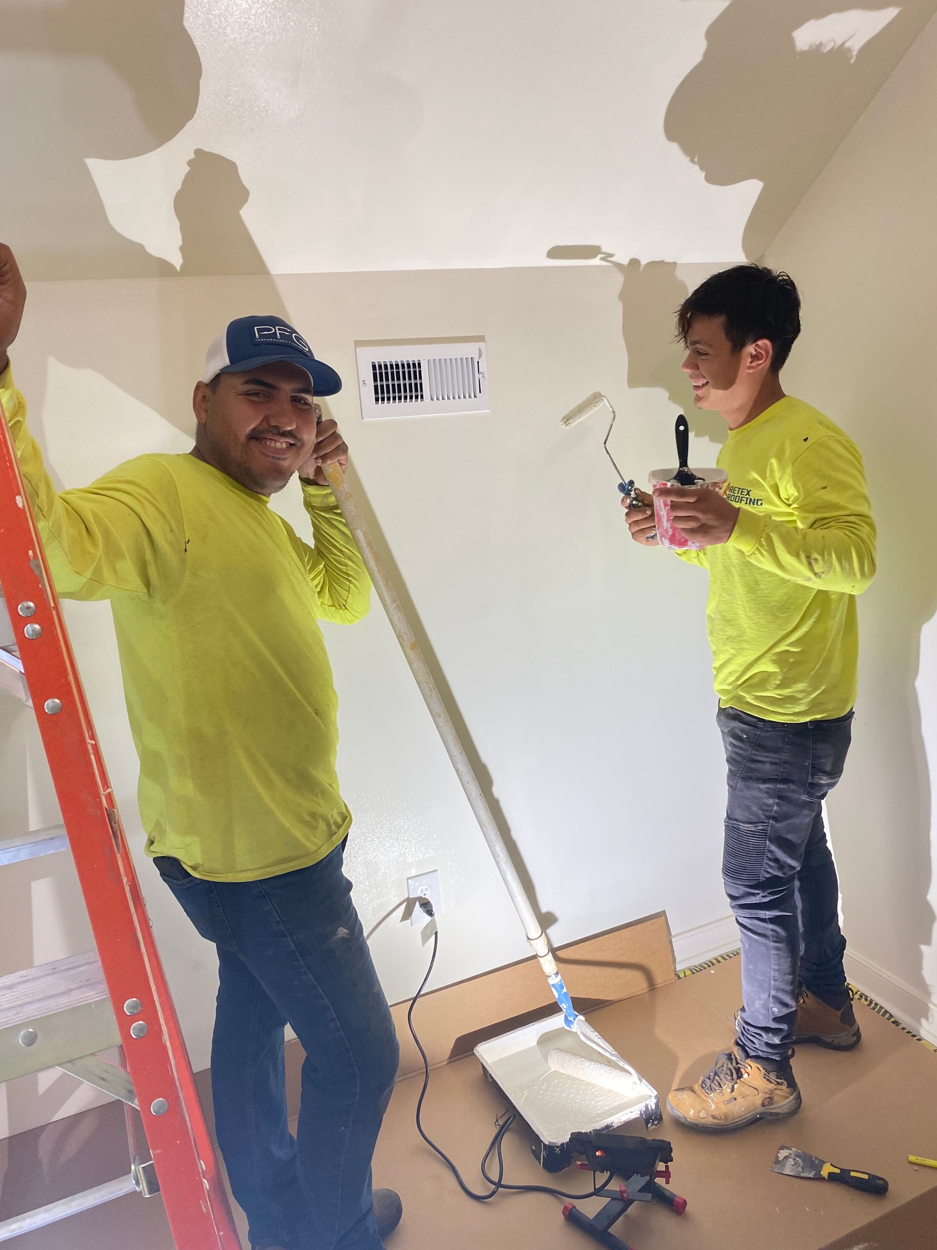 Image of RETEX’s Julio Marin and Bryan Rizo volunteering with Richmond Habitat for Humanity.