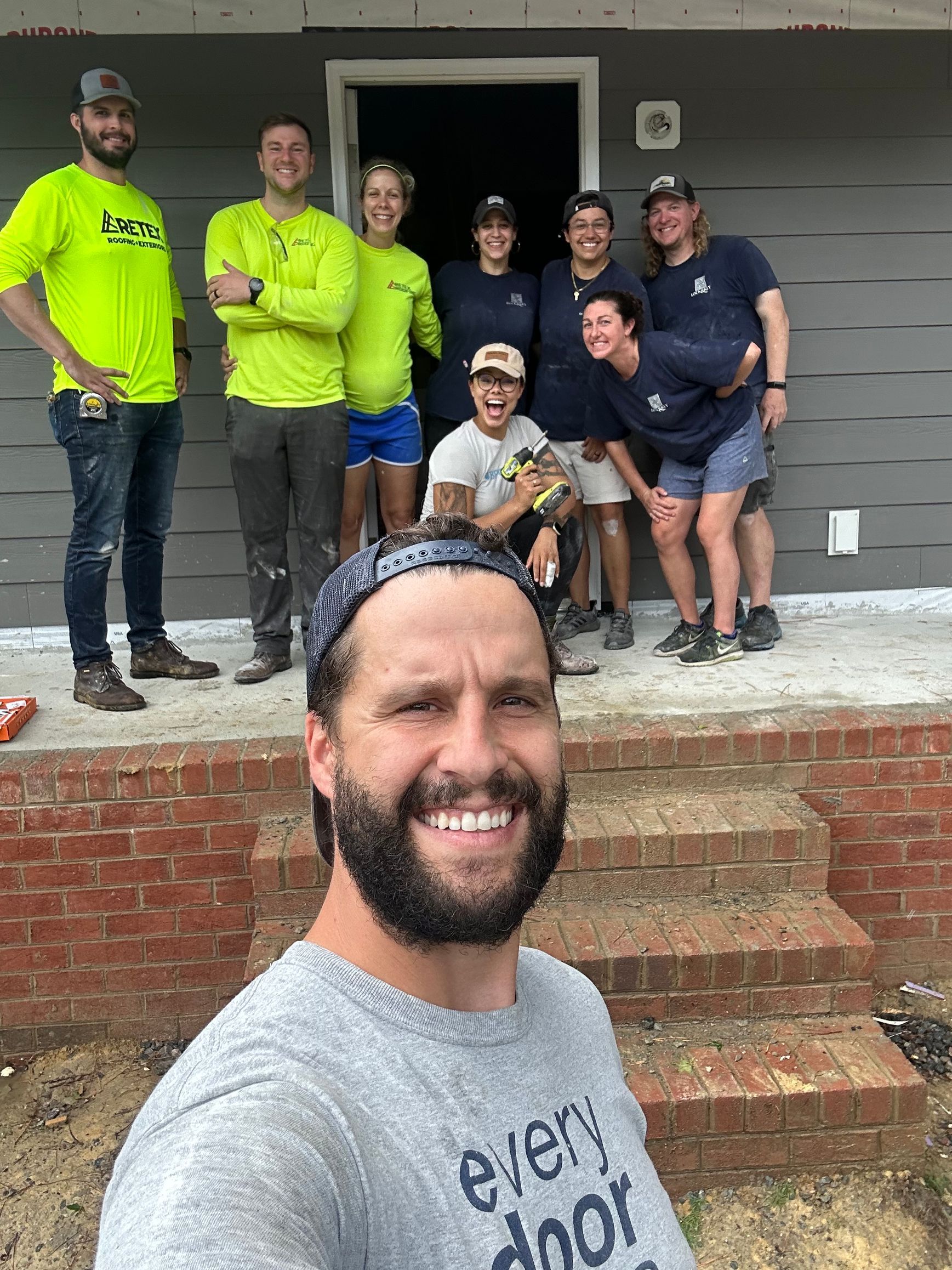 Image of RETEX’s Josh & Katelyn Lewis volunteering with Lock & Key Realty for Richmond Habitat for Humanity.