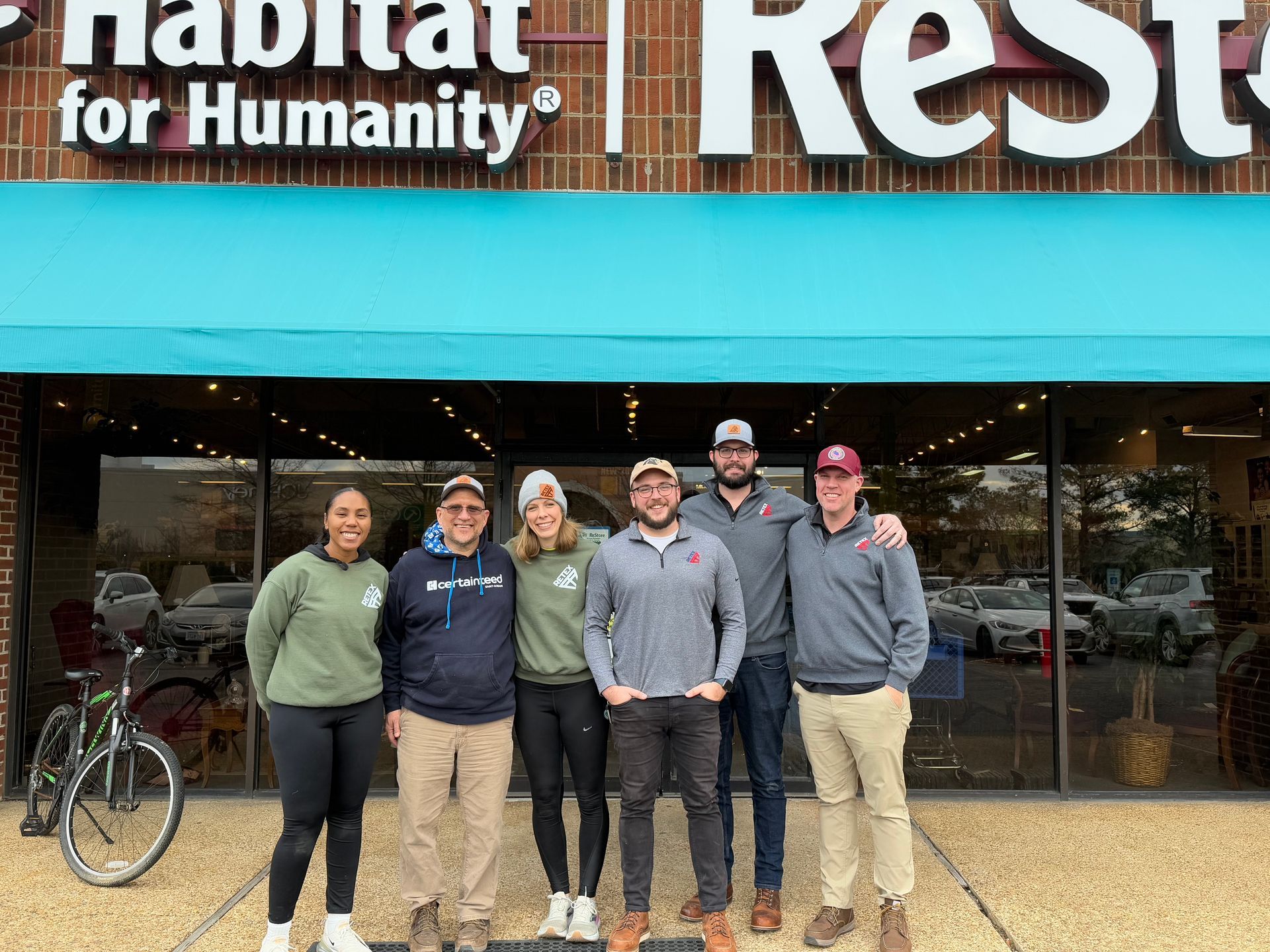 Photo of RETEX's Aaren Davis,Chris Spahr, Katelyn Lewis, Andy Connor, John Gordon, and Mark Erickson at Habitat ReStore.
