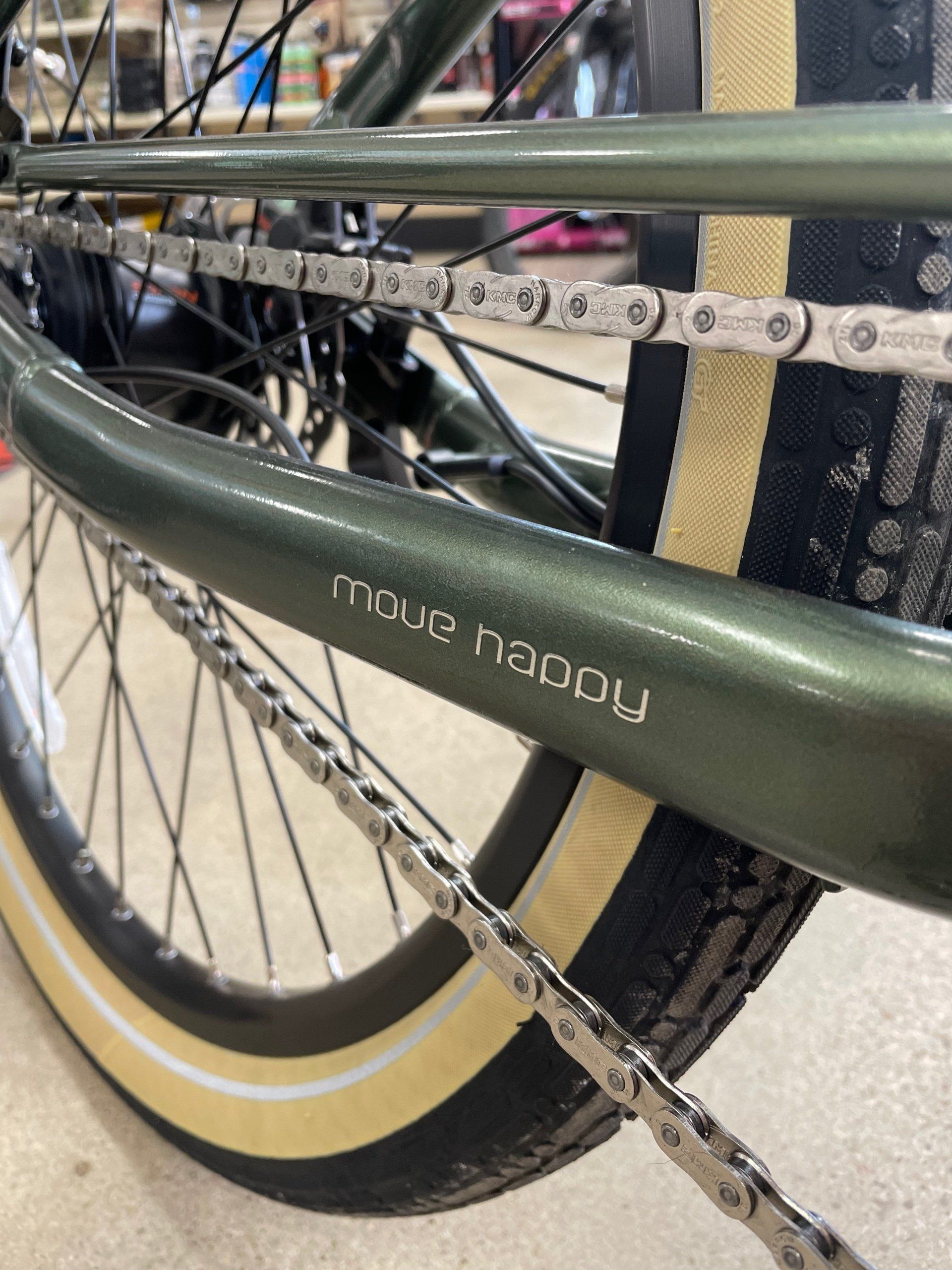 A close up of a bicycle chain and tire