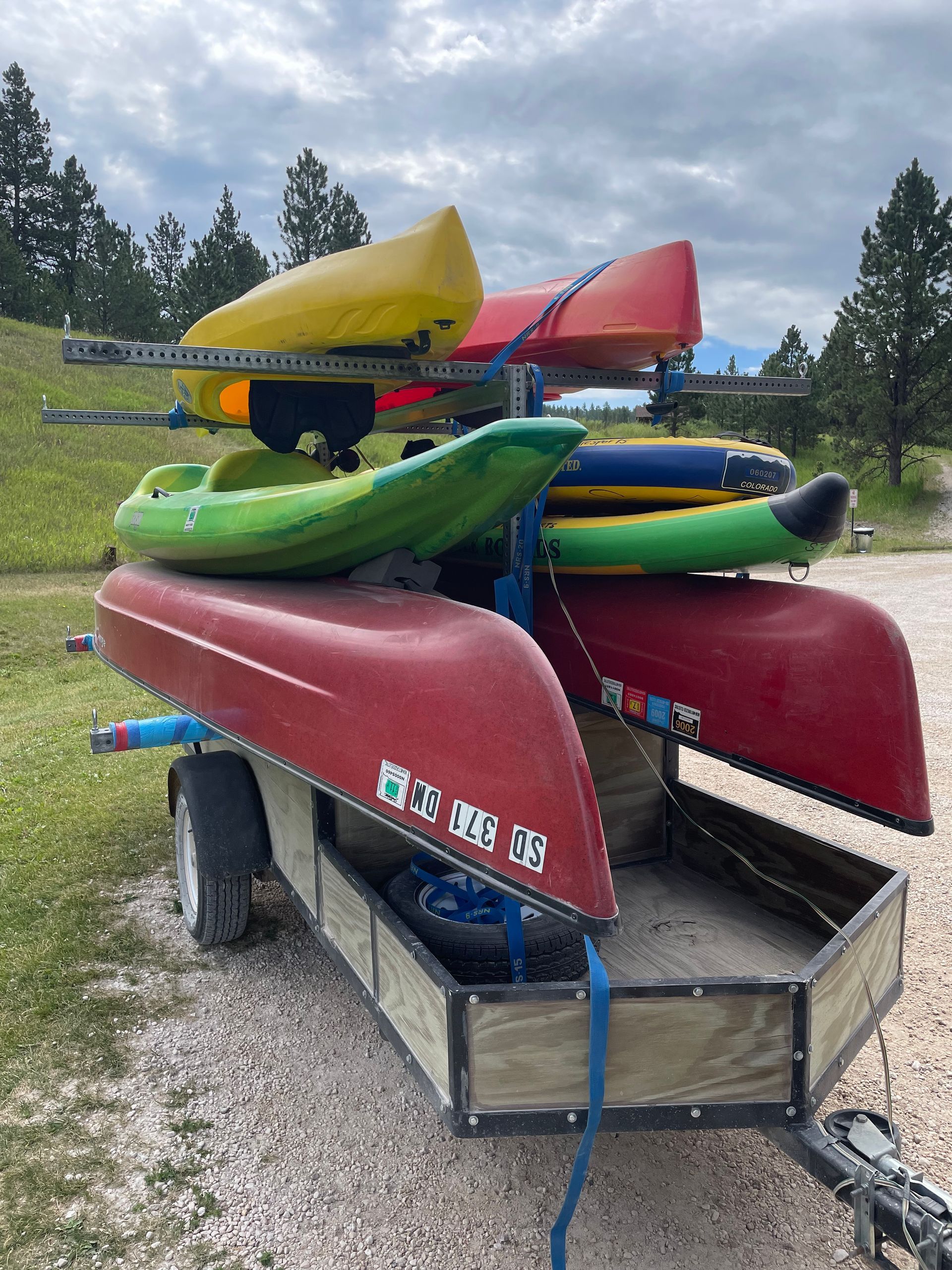 A group of people are rowing kayaks on a lake.