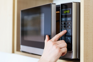 Technician working on repairing microwave error in home in Waco Tx