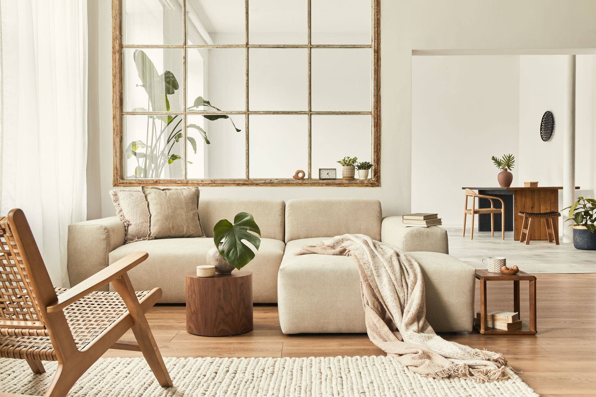 A living room with a couch , chair , table and rug.