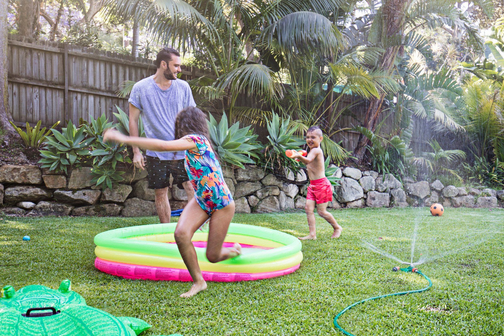 Family Playing in the Lawn — Sydney, NSW — Emerald Lawn Landscape