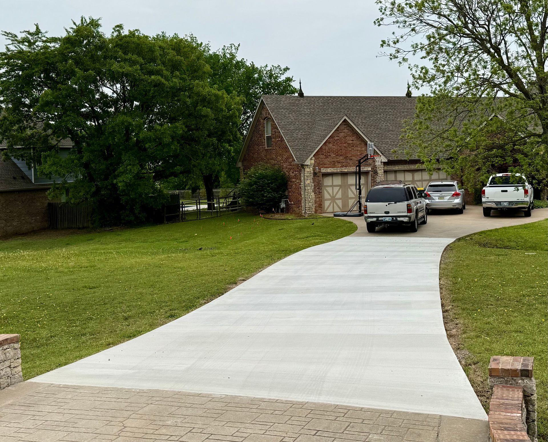 Concrete steps leading down, surrounded by brown mulch.