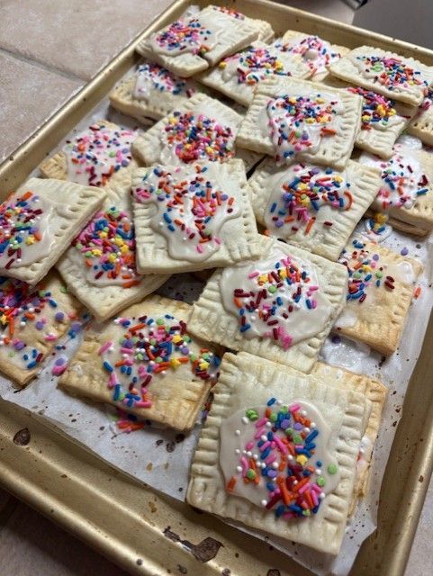 Tray of iced toaster pastries topped with colorful sprinkles